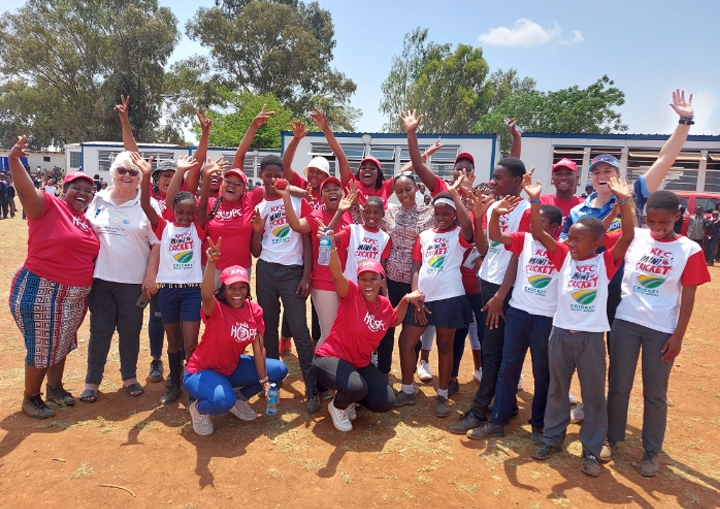 Winning Smiles all round Kutumelo Molefe learners, KFC staff, Pta Sunrise RC - President Doreen Gough in white tee shirt.